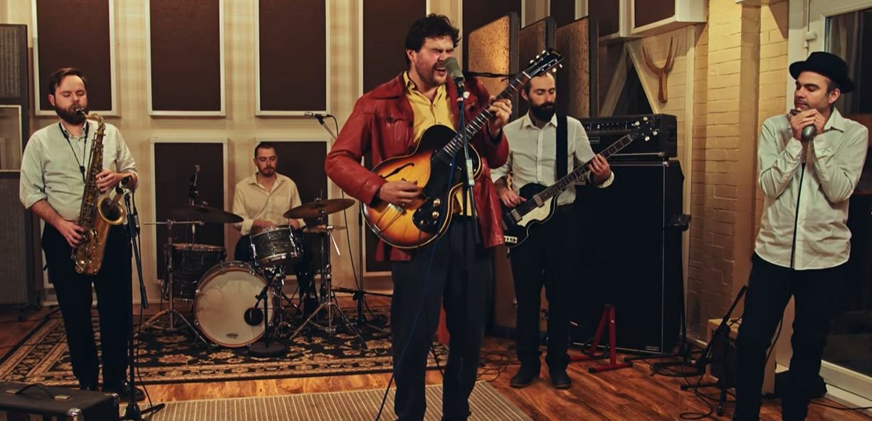 Marco Farris on harmonica recording with a band at Abbey Road Studios