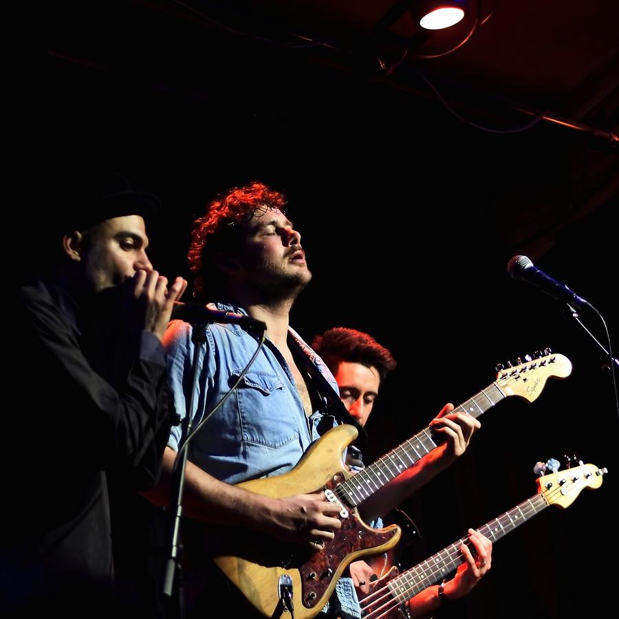 Marco Farris on harmonica with a guitarist and a bass player