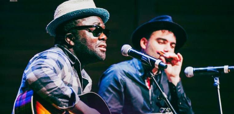Femi Precious on guitar and Marco Farris on harmonica